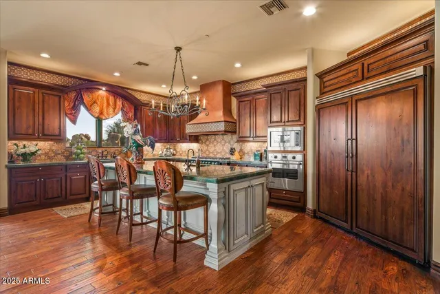 a bathroom with a mirror a sink and a mirror