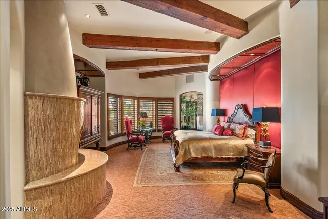 a bedroom with two beds and a couch