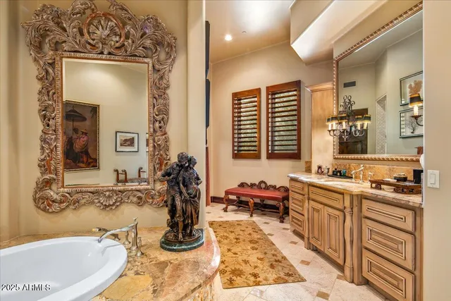 a kitchen with stainless steel appliances granite countertop a stove top oven a sink a dining table and chairs