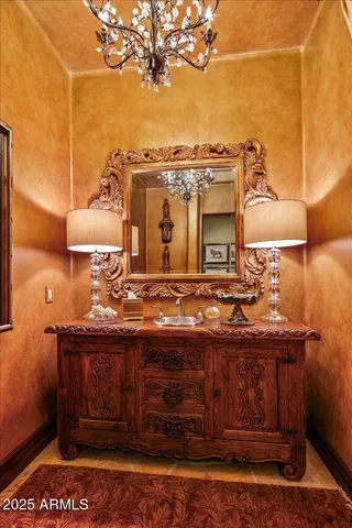 a living room with furniture floor to ceiling window and outdoor view