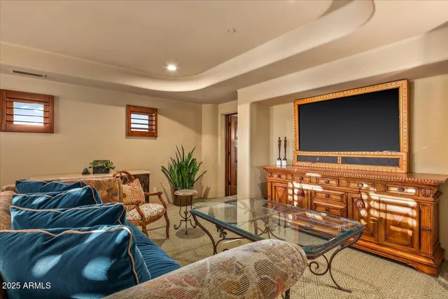 a view of a town with swimming pool and mountains