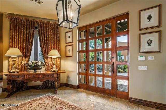 a kitchen with stainless steel appliances granite countertop wooden floors and wooden cabinets