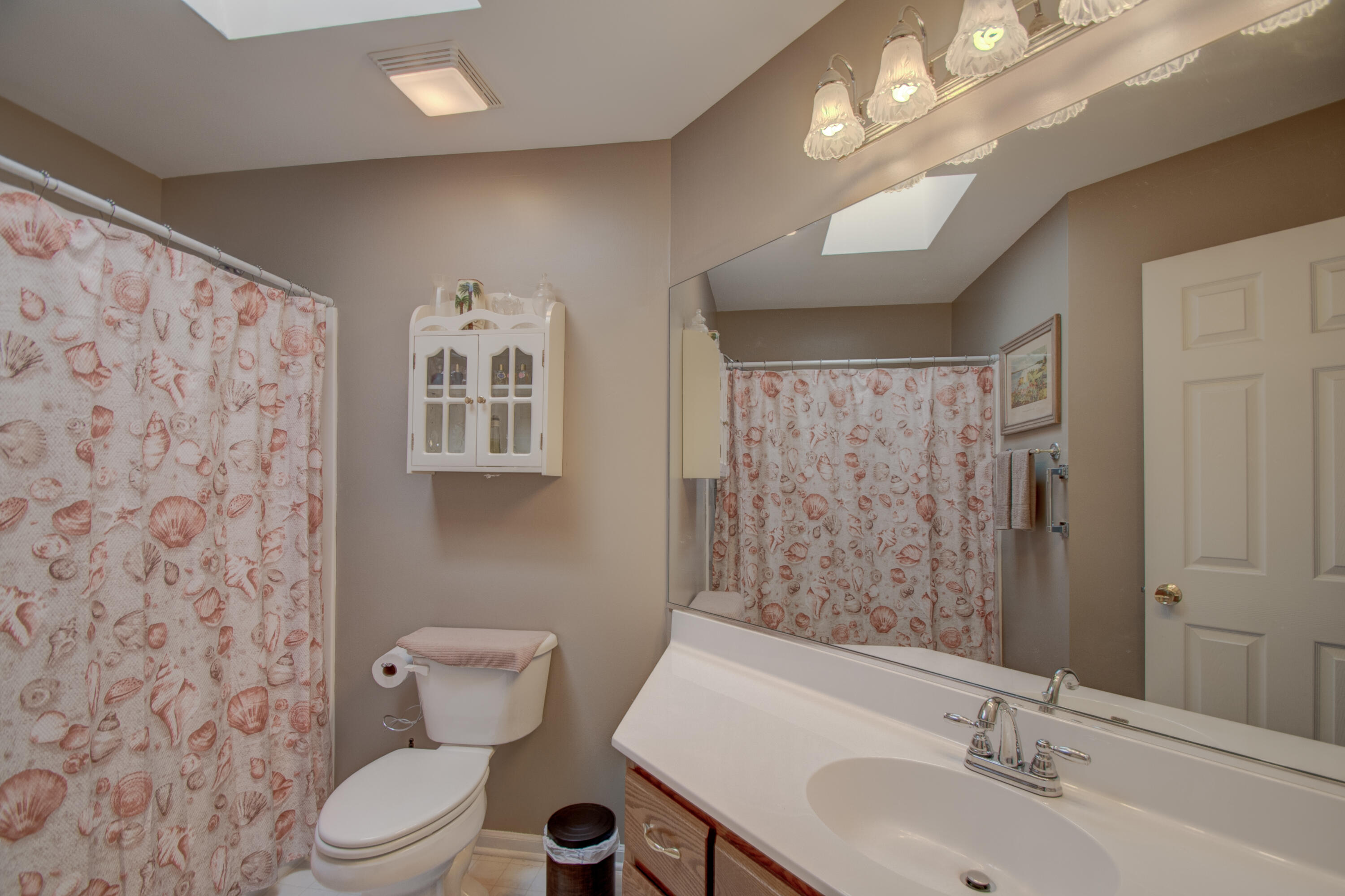 337 Pine Ridge Circle Lowell, IN 46356 - Photo 15 of 26 a bathroom with a toilet sink and mirror
