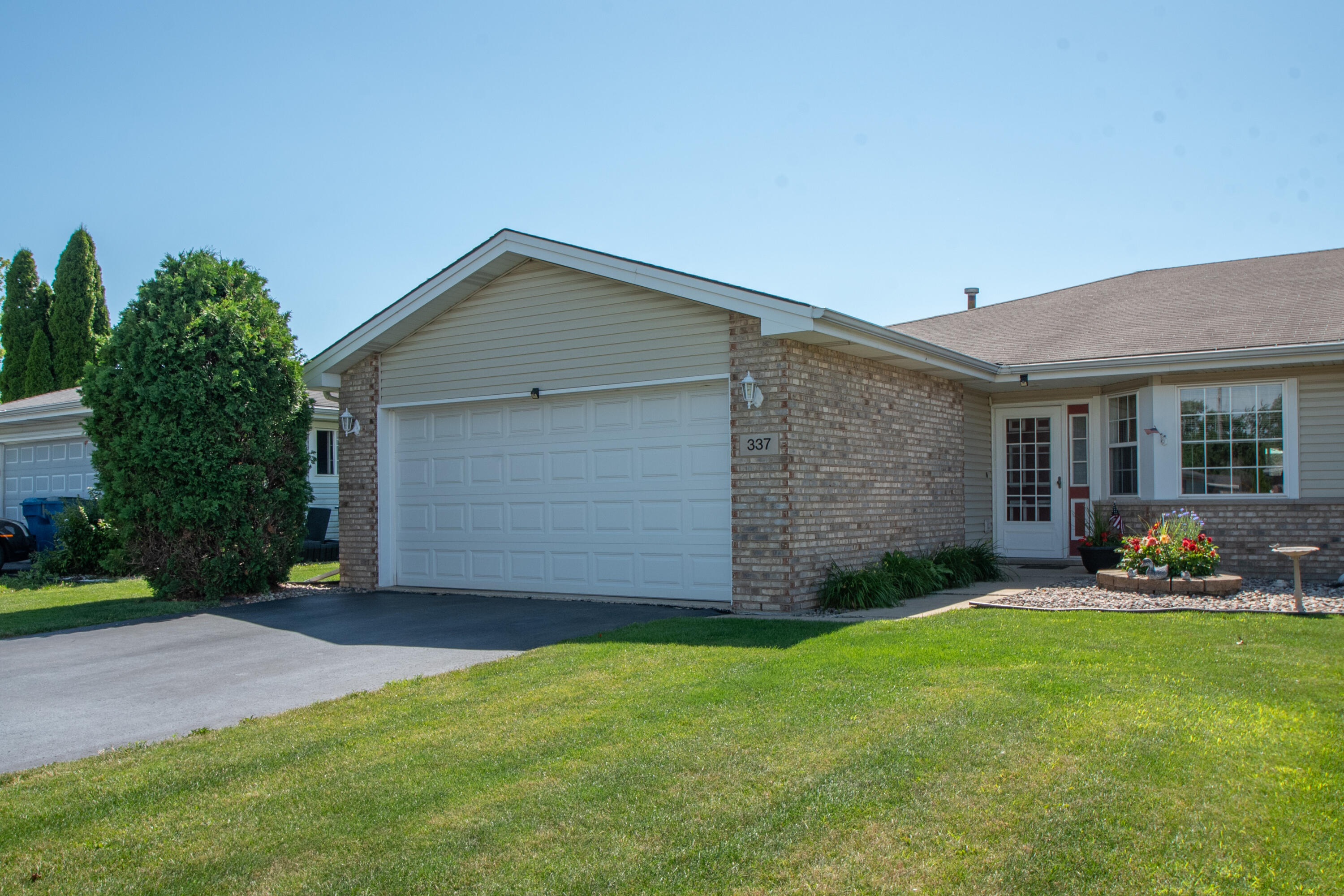 337 Pine Ridge Circle Lowell, IN 46356 - Photo 17 of 26 a view of a house with a yard and pathway