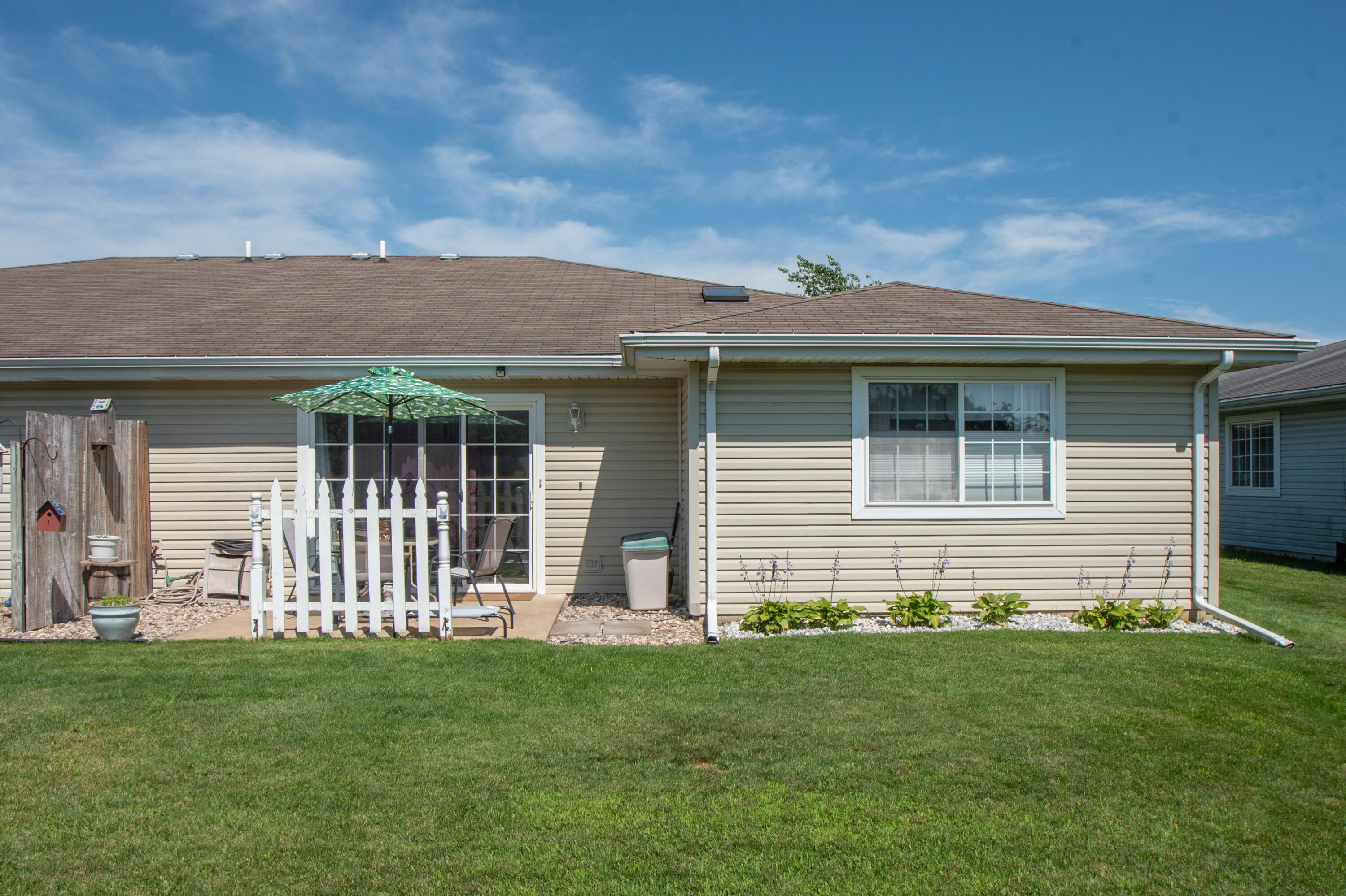 337 Pine Ridge Circle Lowell, IN 46356 - Photo 23 of 26 a front view of a house with a garden