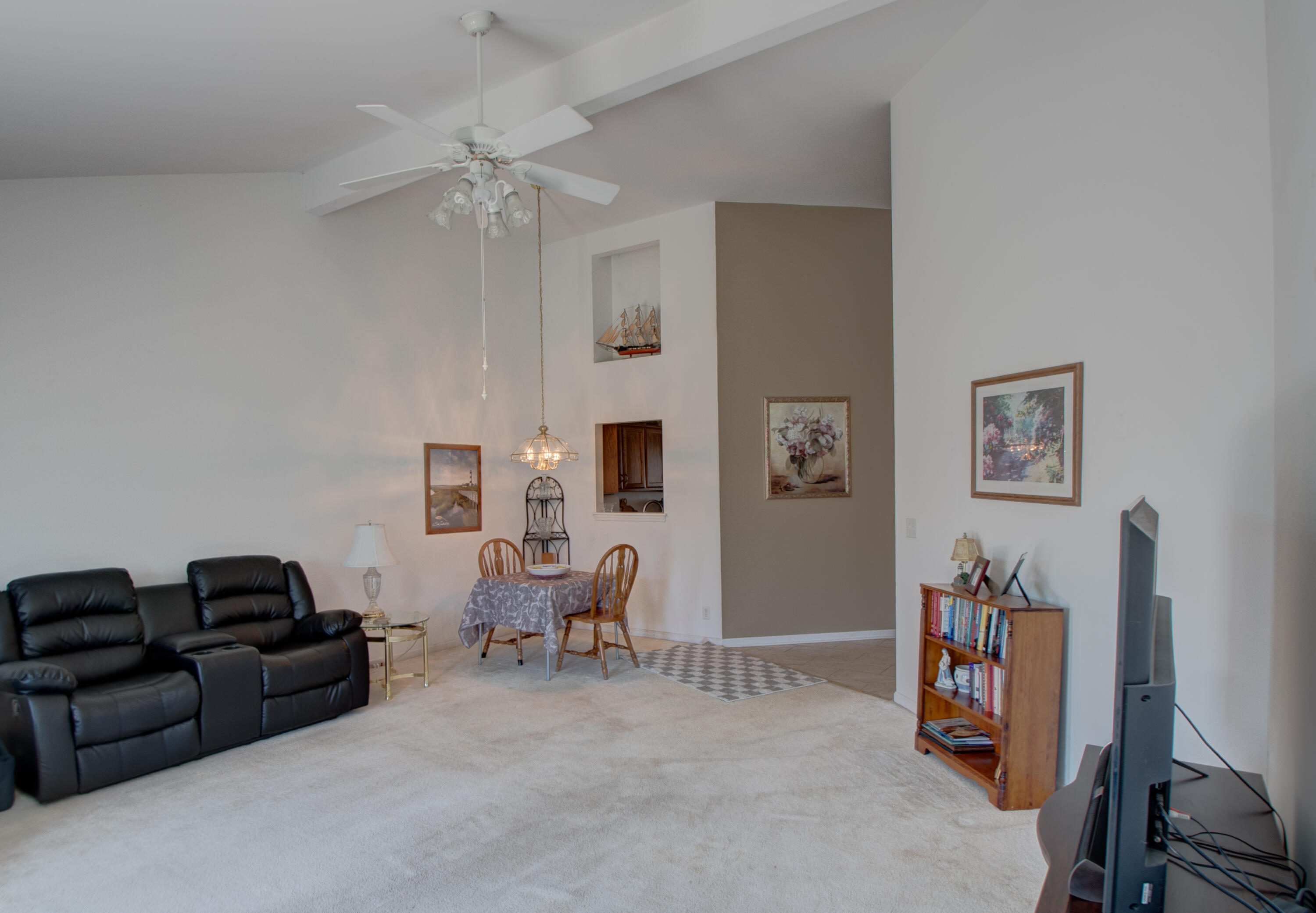 337 Pine Ridge Circle Lowell, IN 46356 - Photo 6 of 26 a living room with furniture a ceiling fan and a window