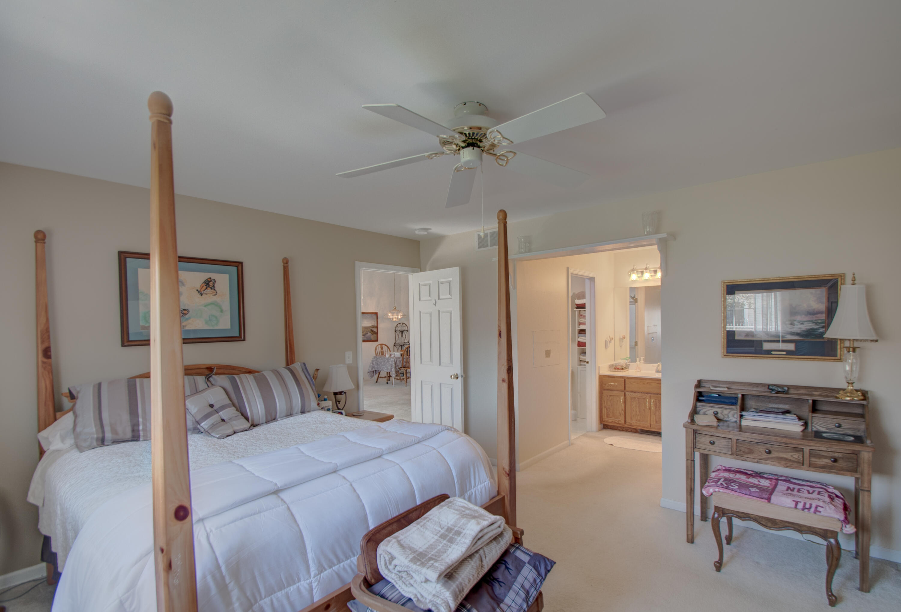 337 Pine Ridge Circle Lowell, IN 46356 - Photo 9 of 26 a bedroom with a bed and a chandelier