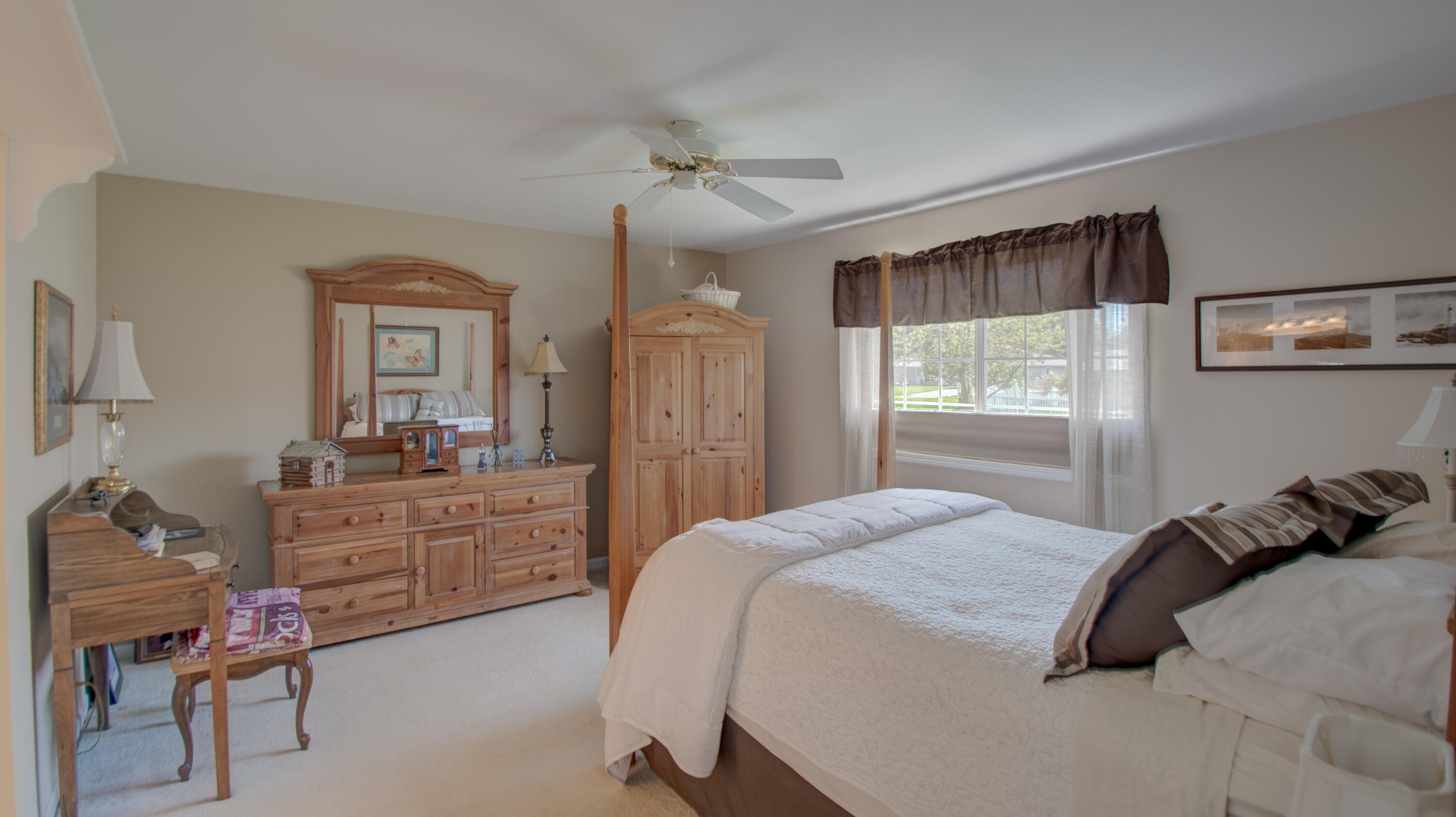 337 Pine Ridge Circle Lowell, IN 46356 - Photo 10 of 26 a bedroom with a bed and a mirror on the dresser