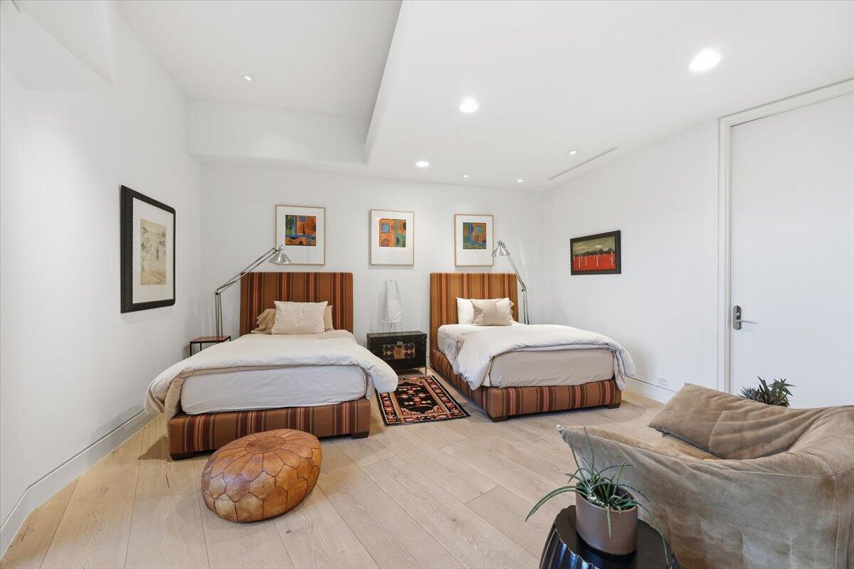 102 Waterford Circle Rancho Mirage, CA 92270 - Photo 19 of 44 a bedroom with two beds and a couch