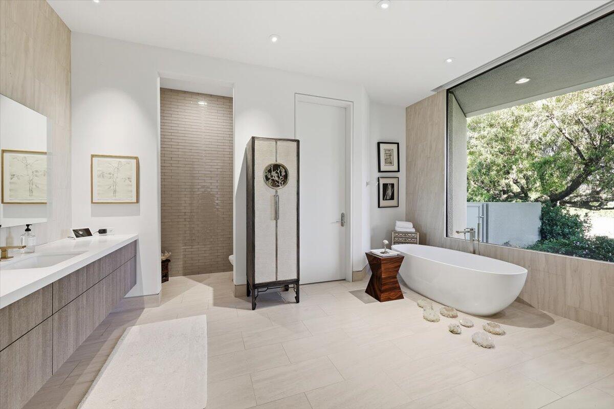 102 Waterford Circle Rancho Mirage, CA 92270 - Photo 24 of 44 a living room with a sink furniture and a large window