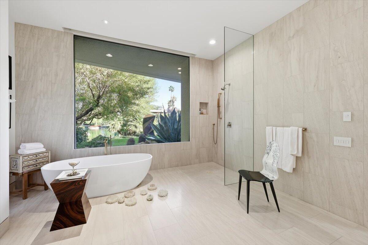 102 Waterford Circle Rancho Mirage, CA 92270 - Photo 25 of 44 a living room with furniture and a large window