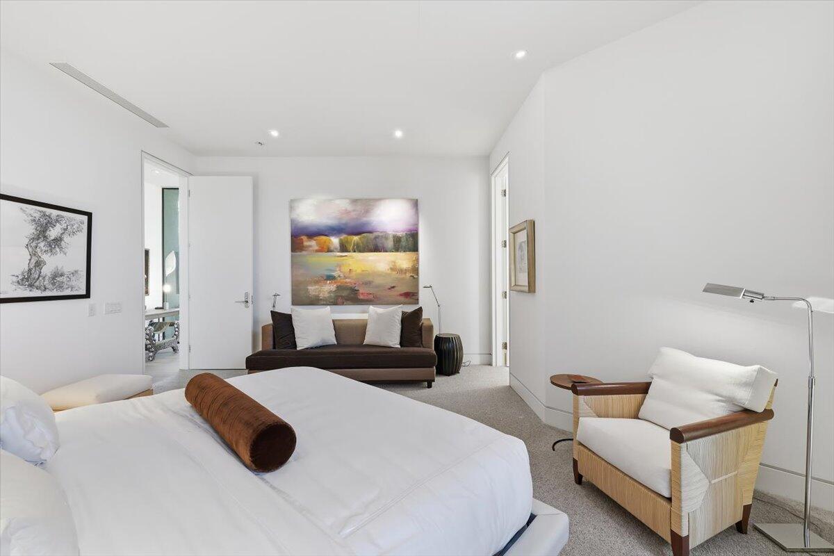 102 Waterford Circle Rancho Mirage, CA 92270 - Photo 31 of 44 a bedroom with a bed and a couch