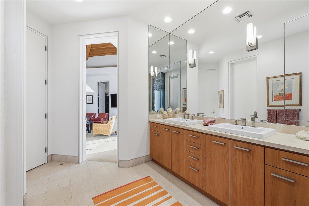 102 Waterford Circle Rancho Mirage, CA 92270 - Photo 32 of 44 a spacious bathroom with a sink a mirror and shower