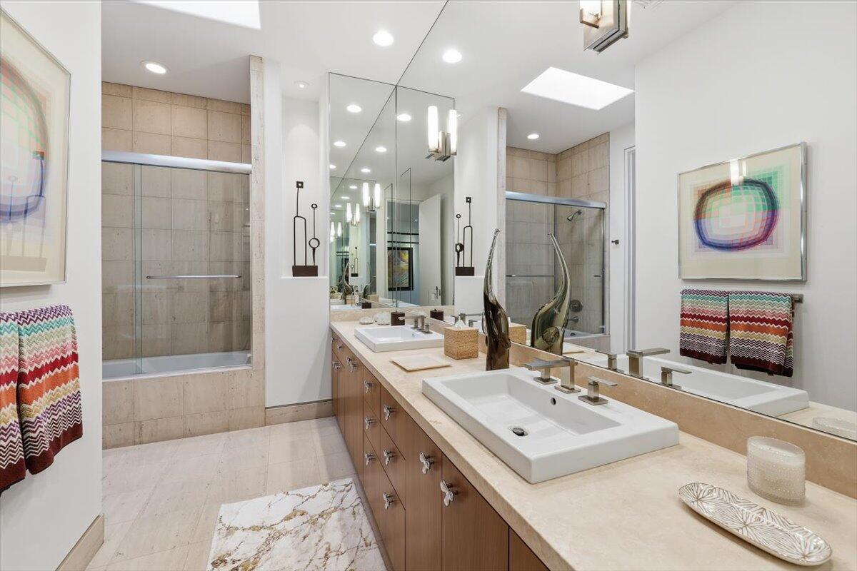 102 Waterford Circle Rancho Mirage, CA 92270 - Photo 35 of 44 a bathroom with a double vanity sink mirror and shower