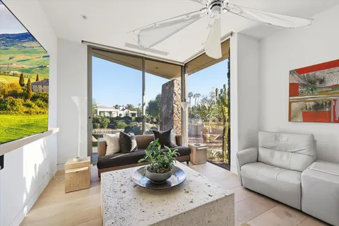 a very nice looking dining room with a large window