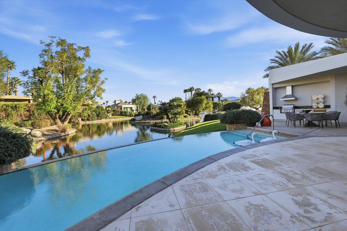102 Waterford Circle Rancho Mirage, CA 92270 - Photo 37 of 44 a view of a swimming pool with furniture