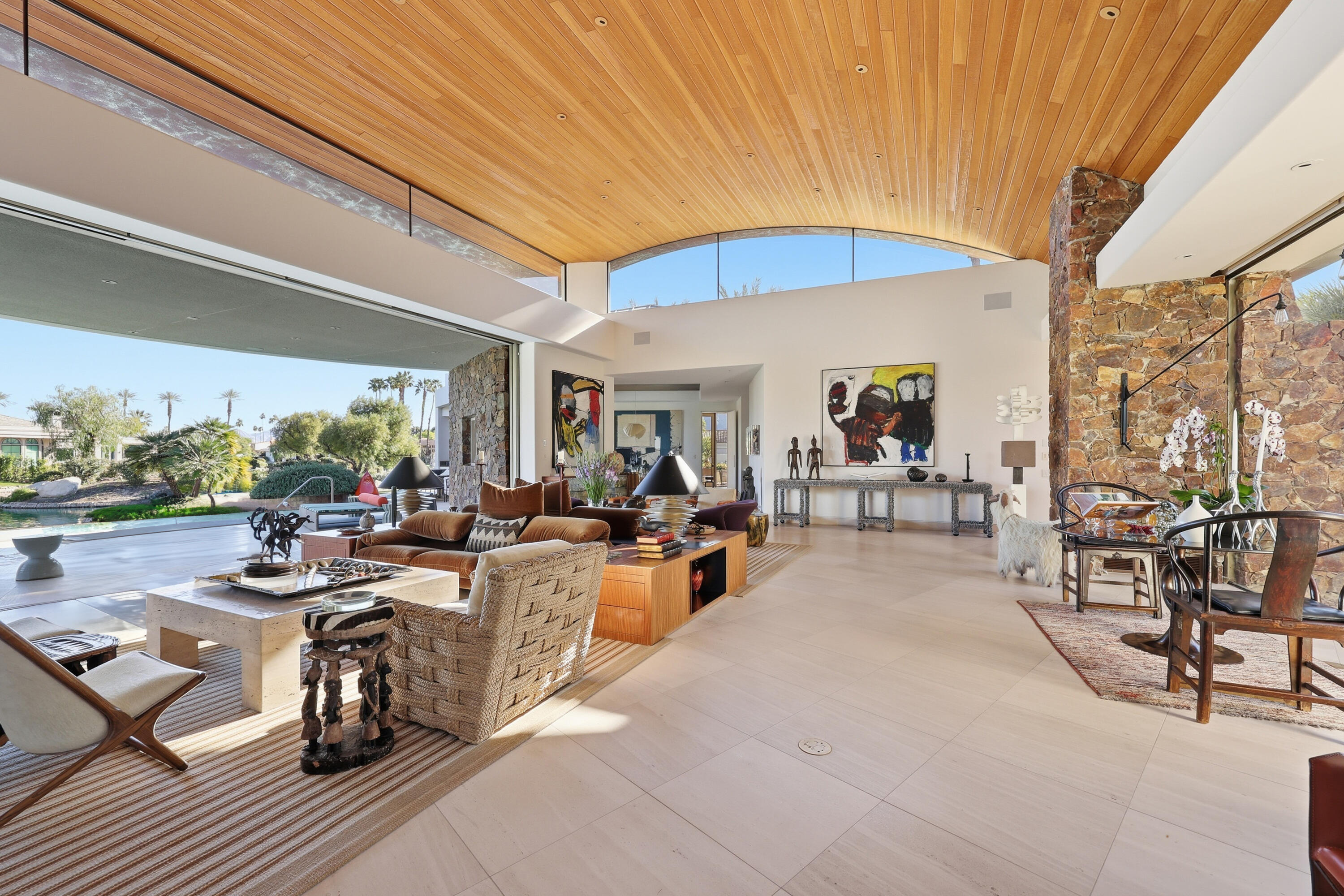 102 Waterford Circle Rancho Mirage, CA 92270 - Photo 9 of 44 a view of a patio with dining table and chairs under an umbrella