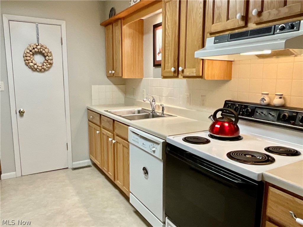  The kitchen bight with light, pantry door shown.