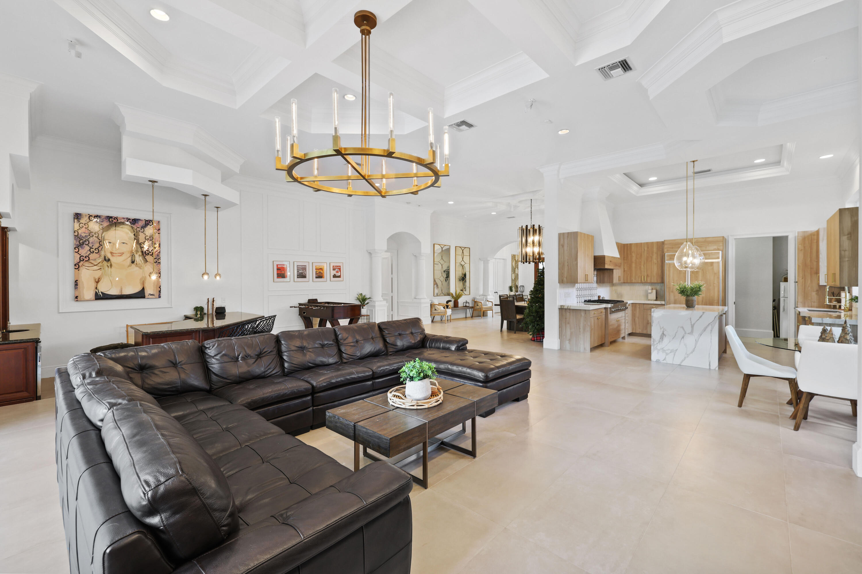 562 Rookery Place Jupiter, FL 33458 - Photo 12 of 72 a living room with furniture kitchen and a chandelier