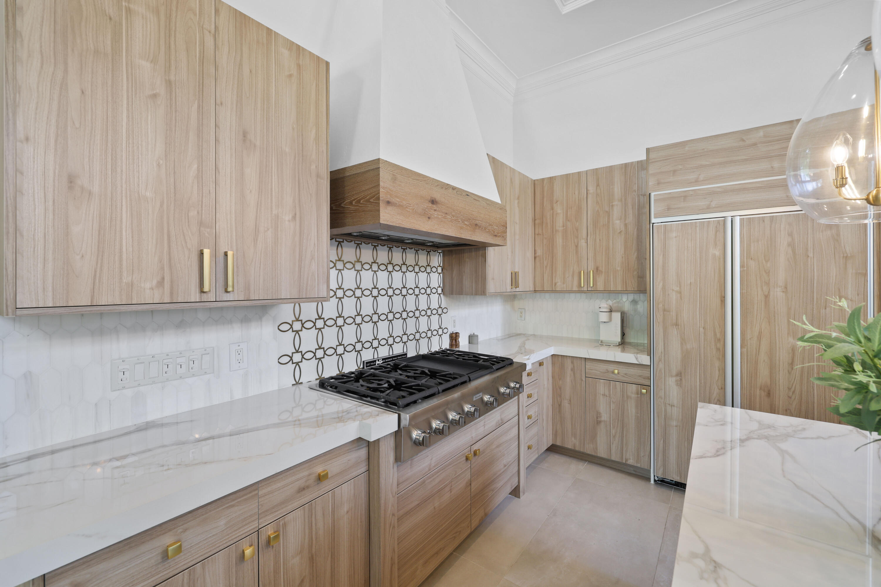 562 Rookery Place Jupiter, FL 33458 - Photo 15 of 72 a kitchen with stainless steel appliances a stove a sink and a refrigerator