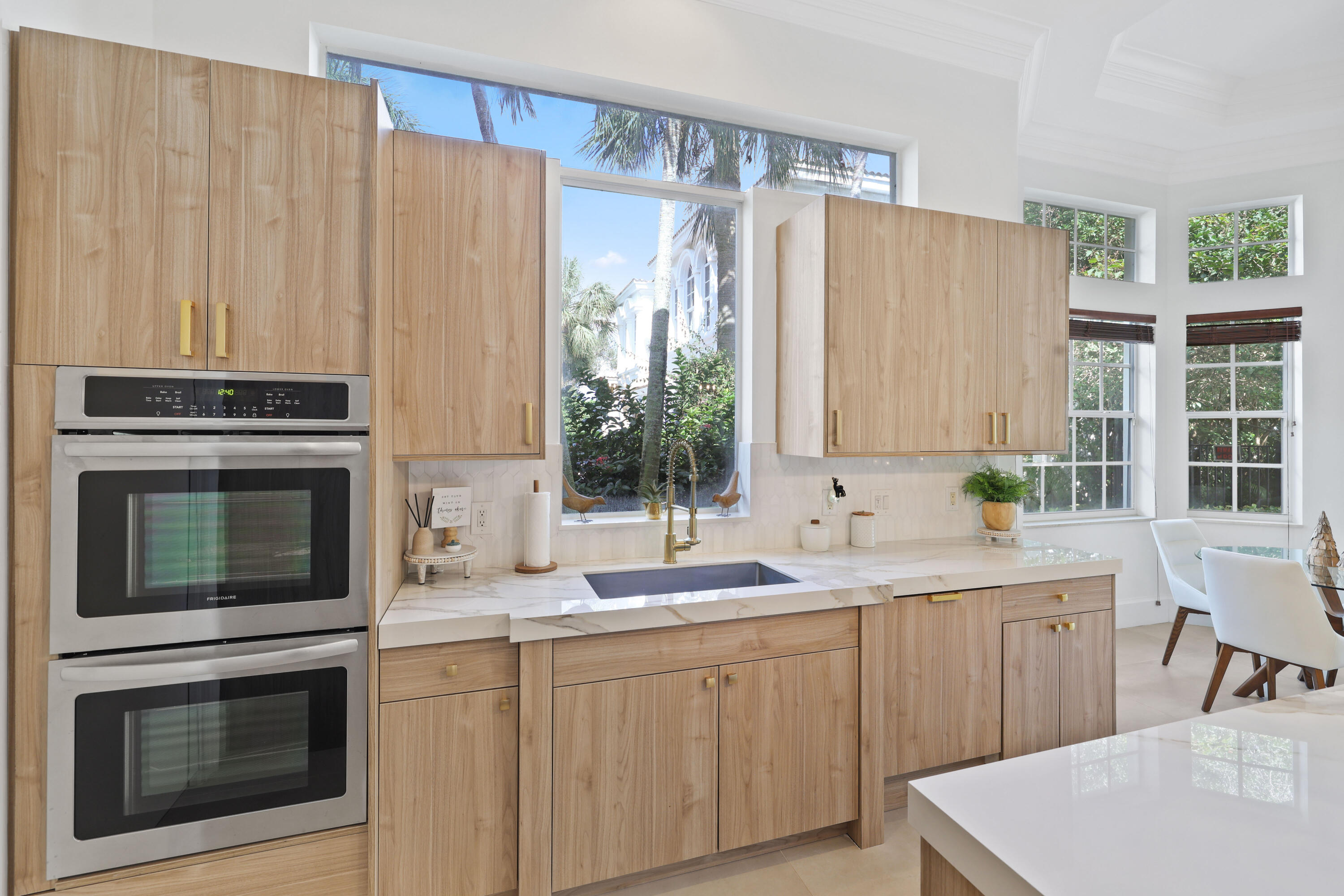 562 Rookery Place Jupiter, FL 33458 - Photo 19 of 72 a kitchen with stainless steel appliances a stove sink and microwave