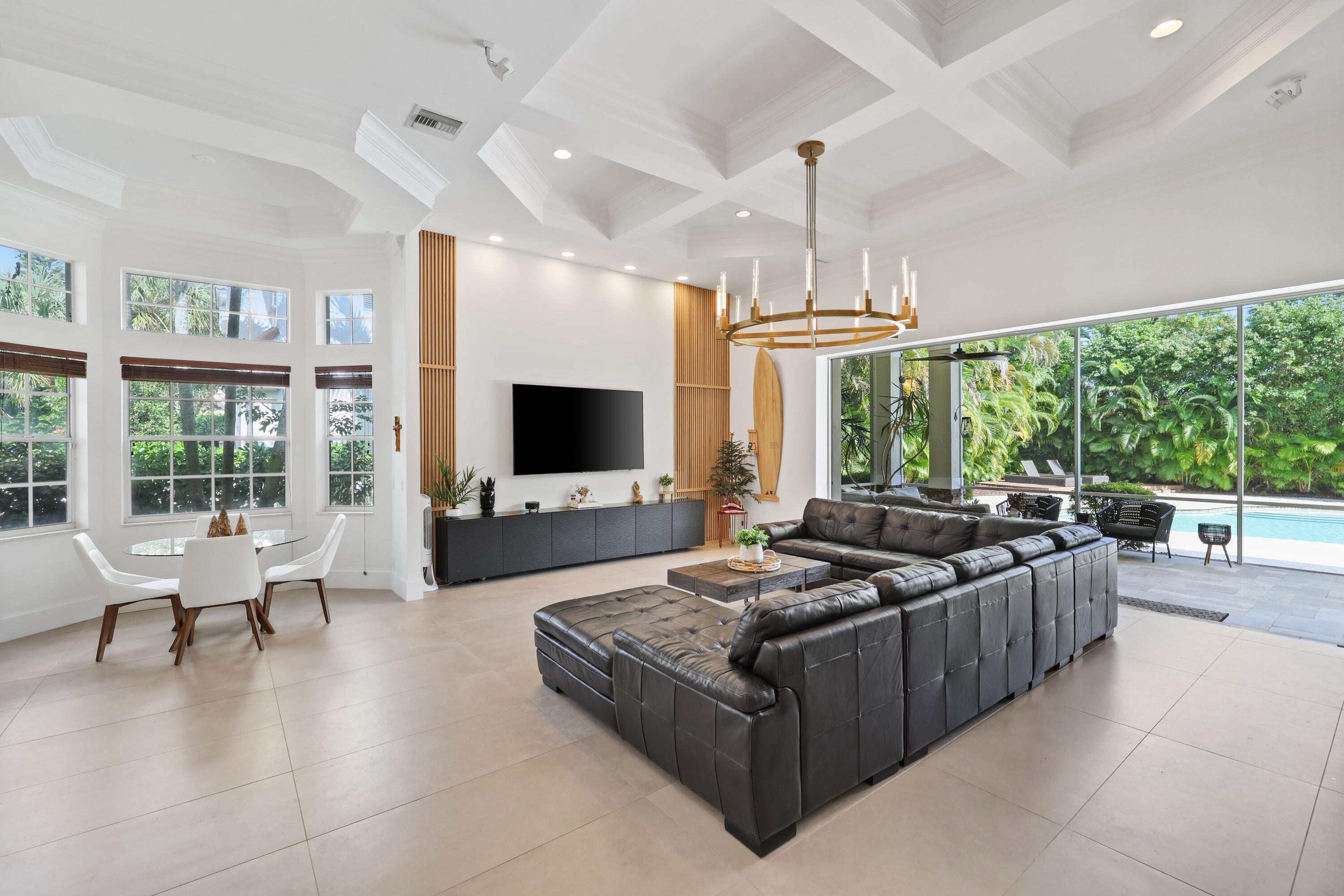 562 Rookery Place Jupiter, FL 33458 - Photo 22 of 72 a living room with furniture large window and flat screen tv