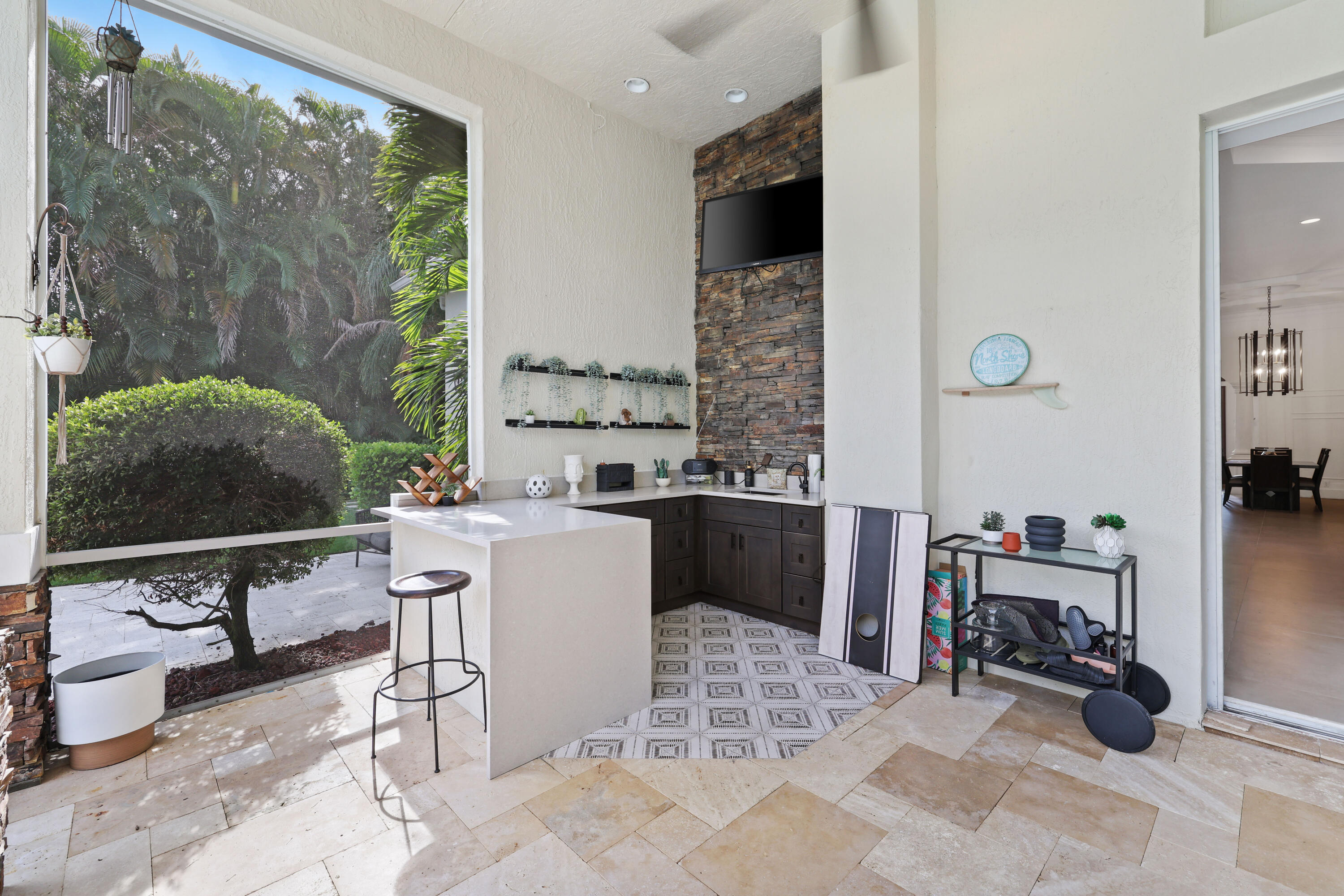 562 Rookery Place Jupiter, FL 33458 - Photo 26 of 72 a living room with furniture a rug and a flat screen tv