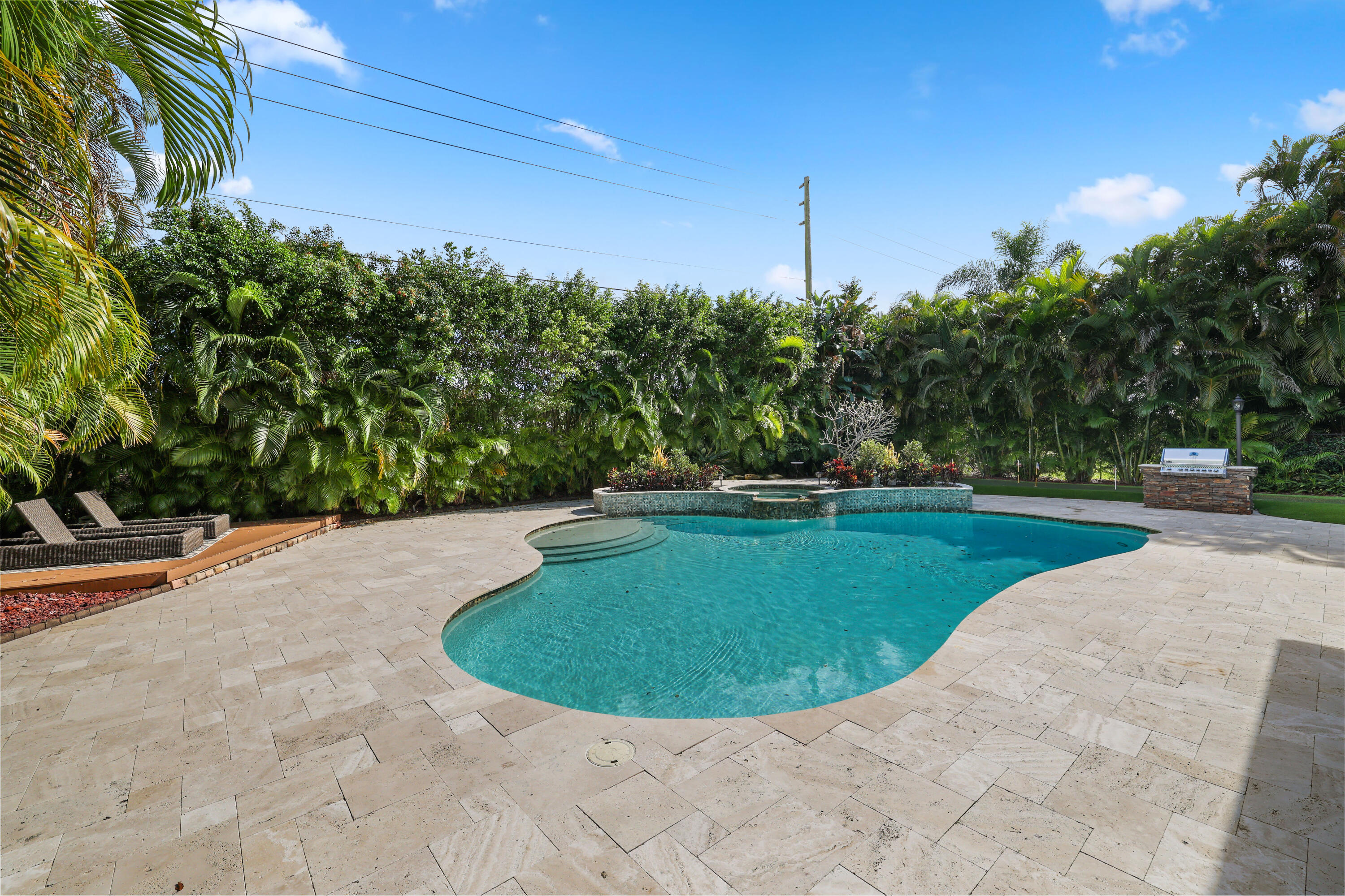 562 Rookery Place Jupiter, FL 33458 - Photo 27 of 72 a view of a swimming pool with a yard