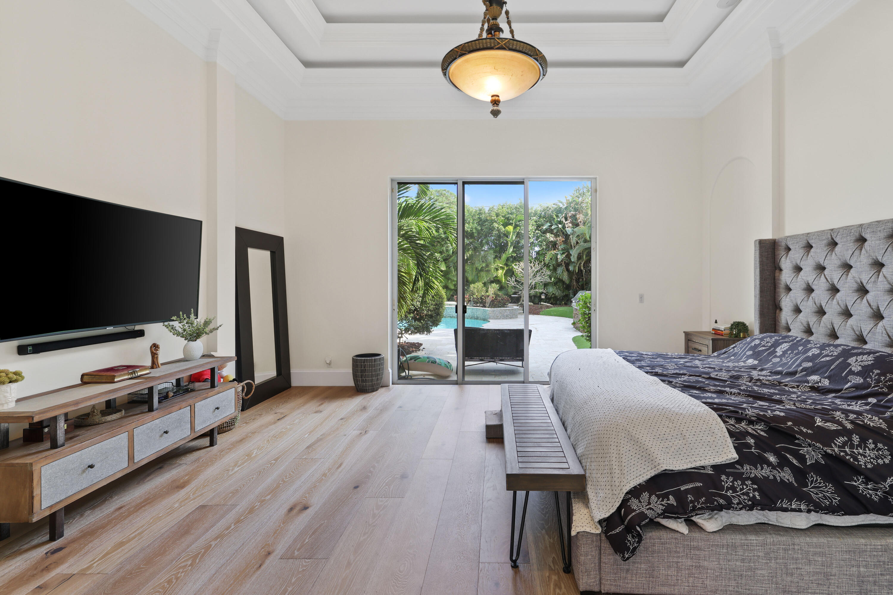 562 Rookery Place Jupiter, FL 33458 - Photo 34 of 72 a bedroom with furniture and a flat screen tv