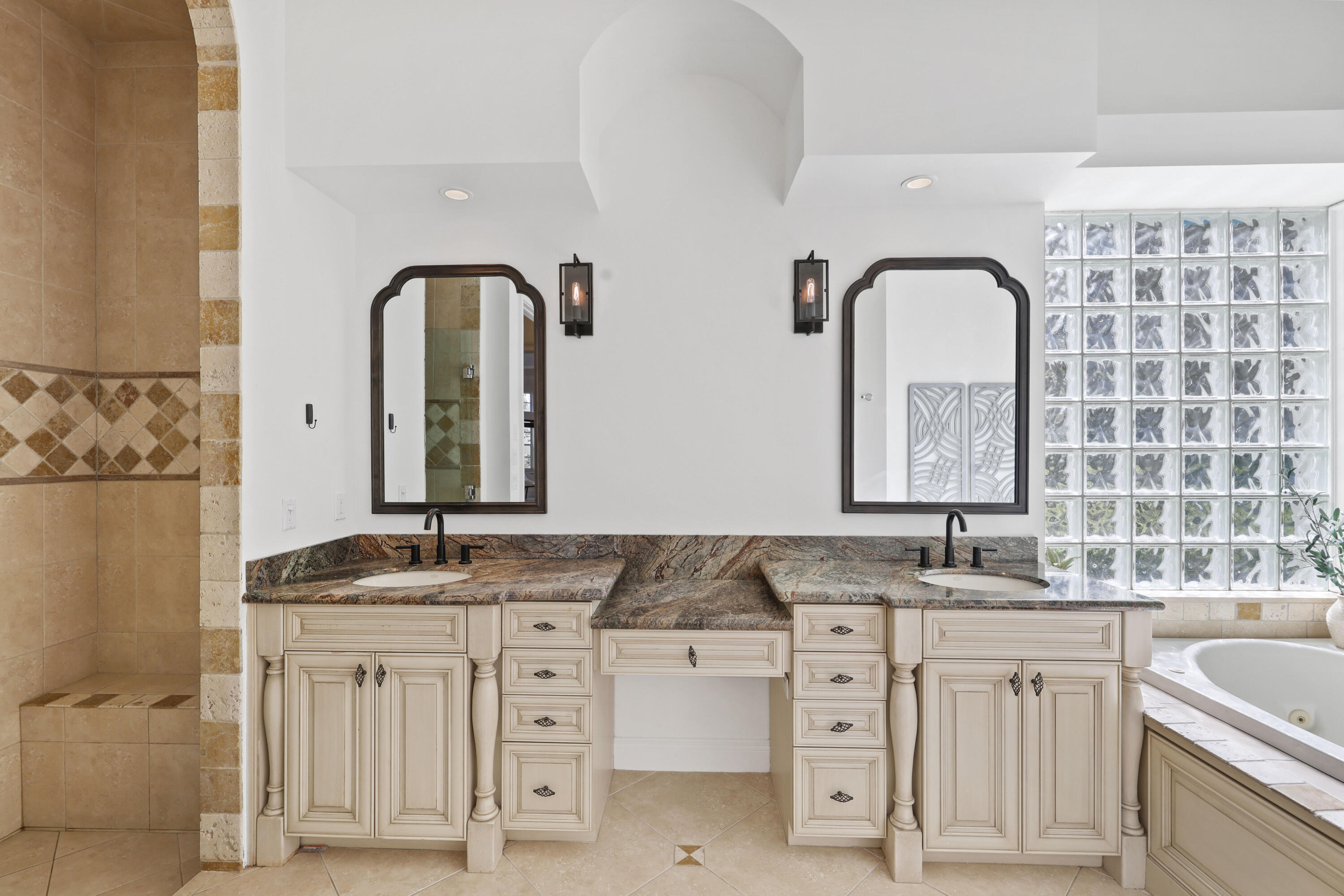 562 Rookery Place Jupiter, FL 33458 - Photo 37 of 72 a bathroom with a granite countertop sink a large mirror and a