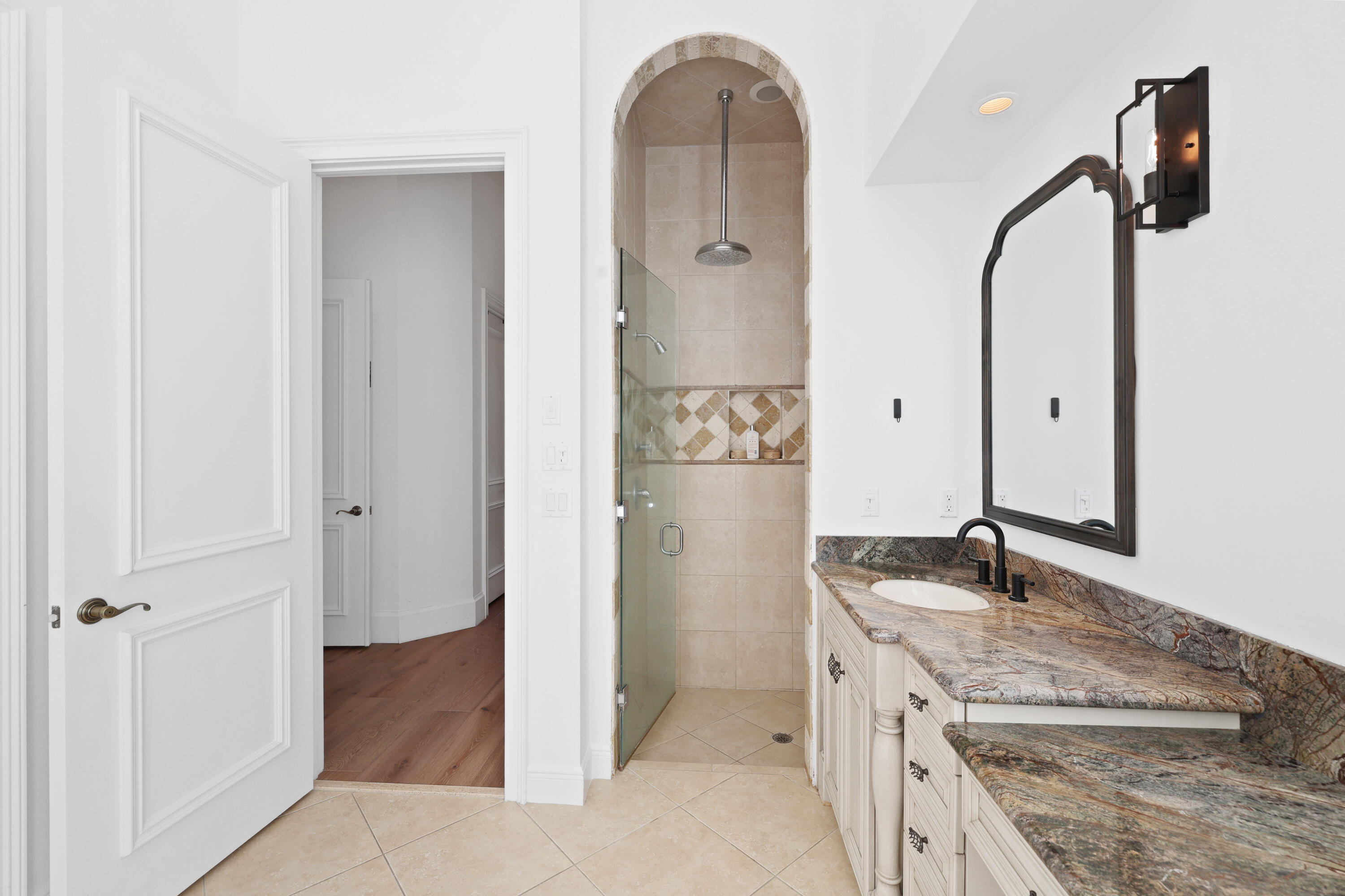 562 Rookery Place Jupiter, FL 33458 - Photo 38 of 72 a bathroom with a granite countertop sink a mirror and shower