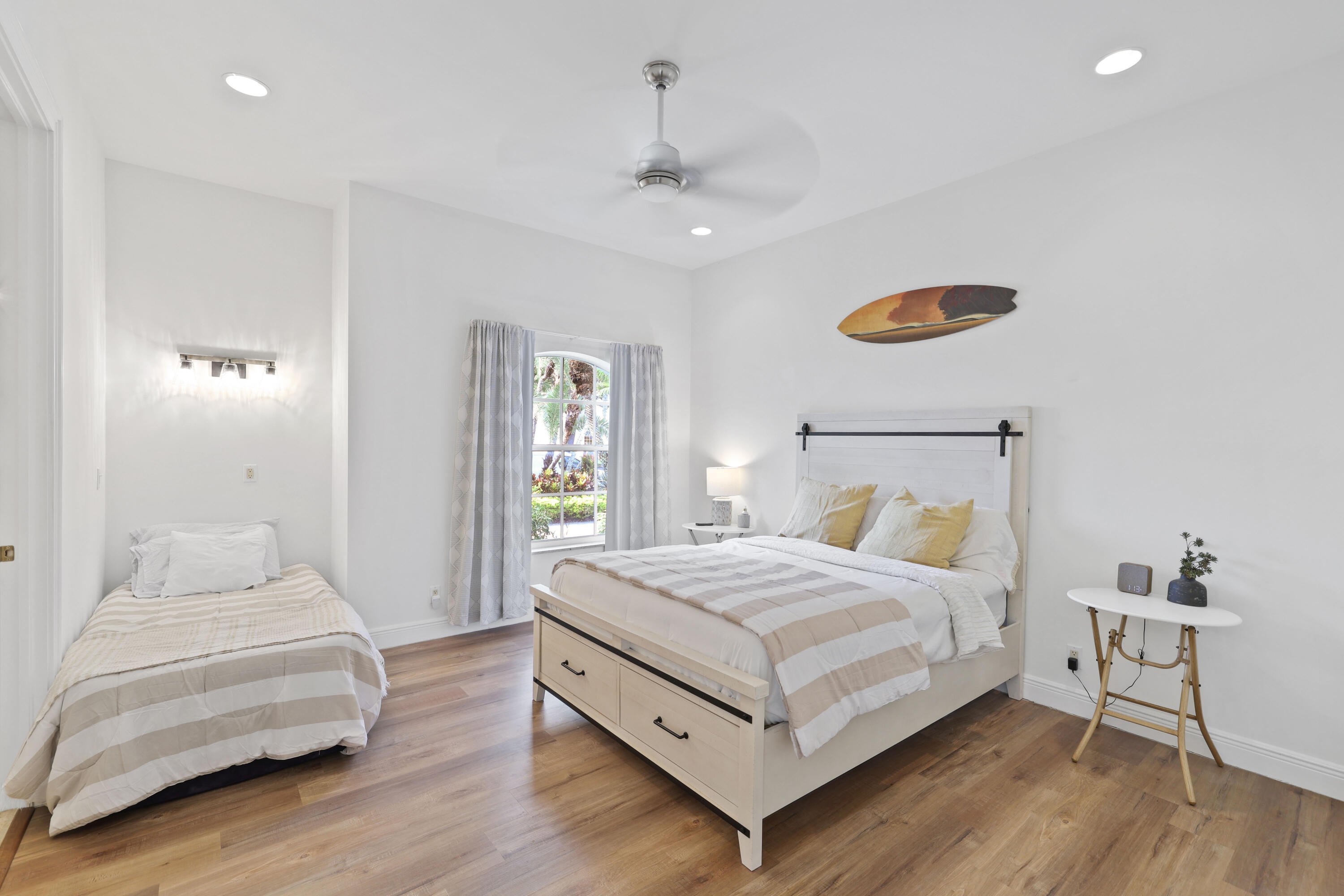 562 Rookery Place Jupiter, FL 33458 - Photo 60 of 72 a bedroom with a bed and a table