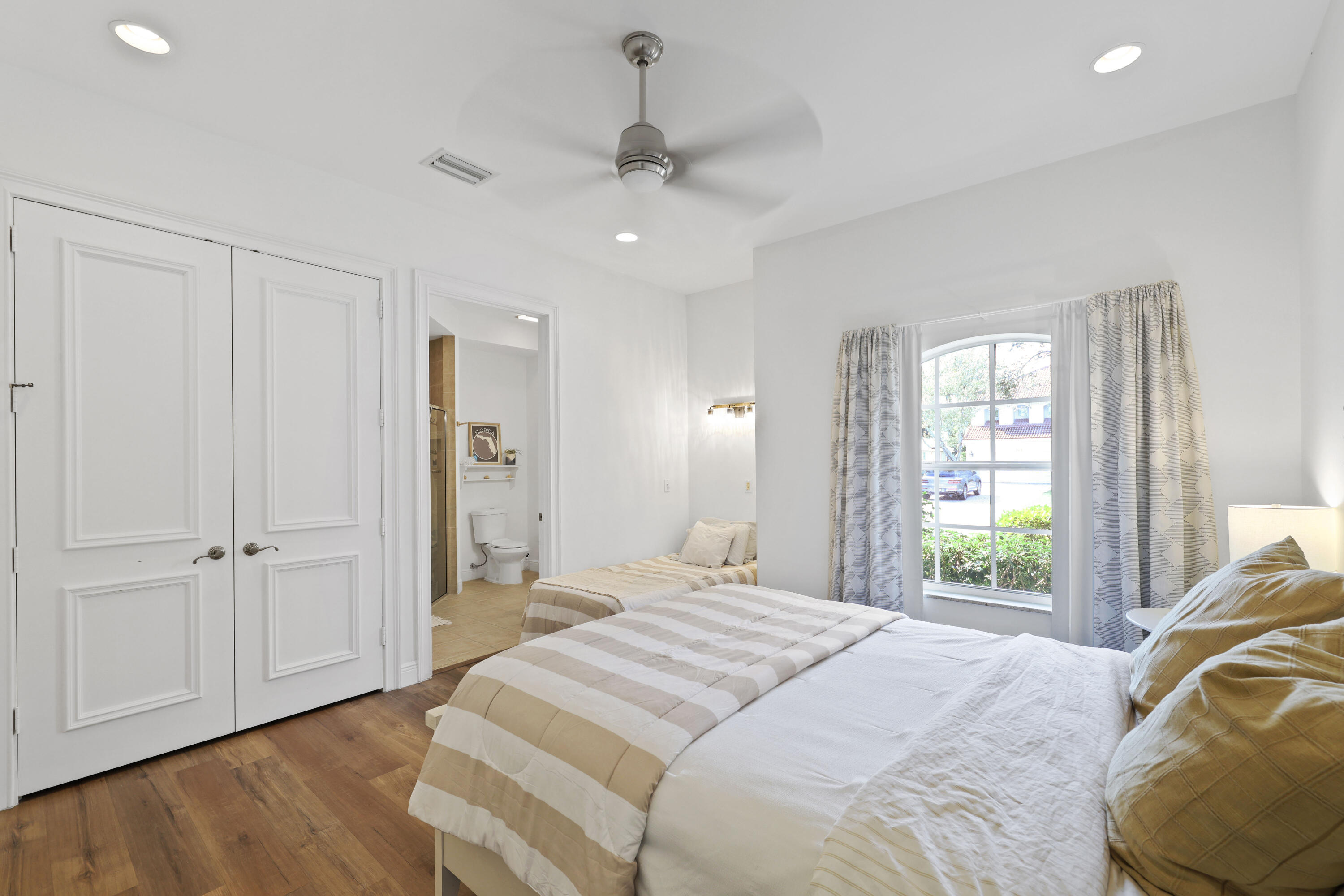 562 Rookery Place Jupiter, FL 33458 - Photo 61 of 72 a bedroom with a bed and a window