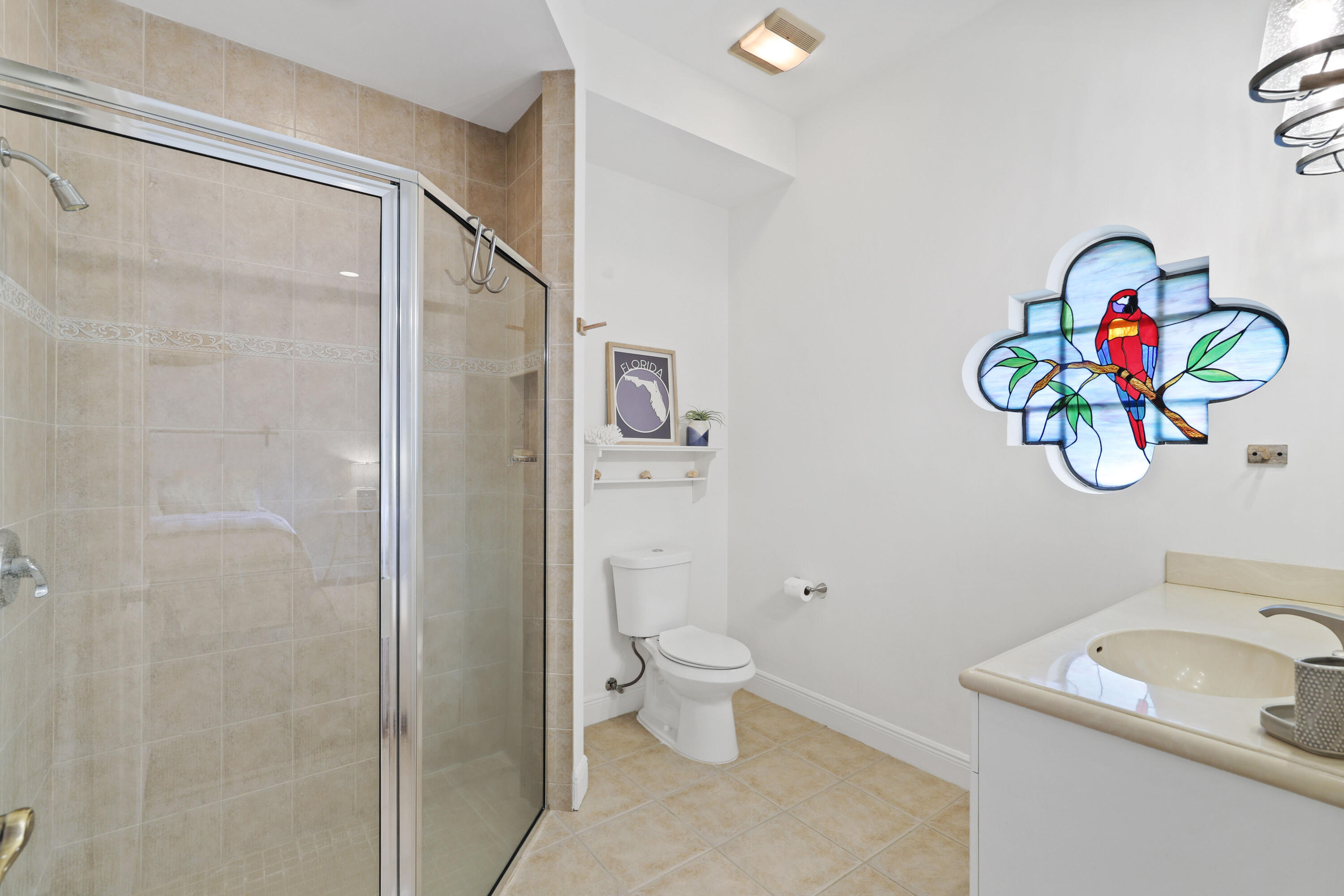 562 Rookery Place Jupiter, FL 33458 - Photo 62 of 72 a bathroom with a sink a toilet and a shower