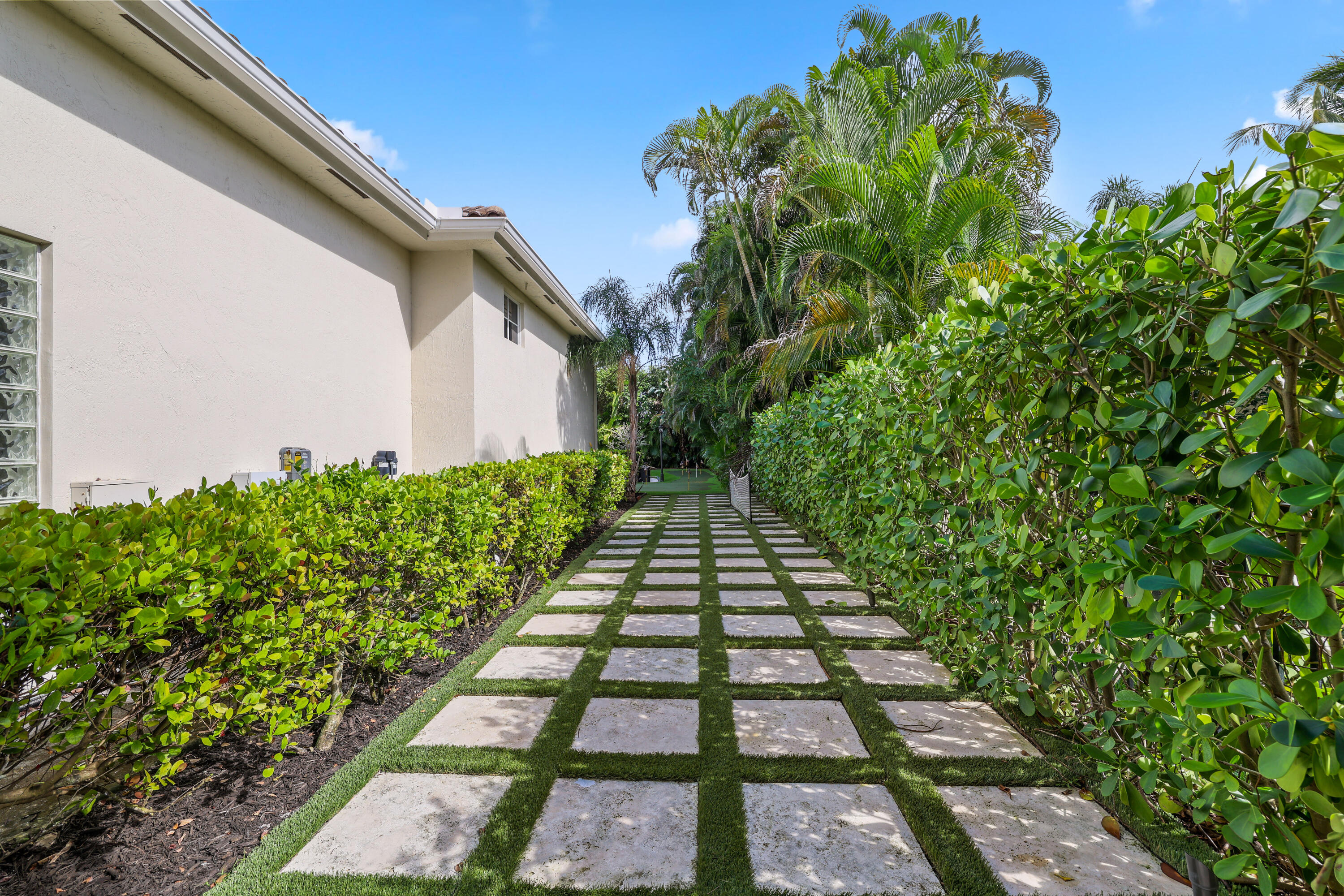 562 Rookery Place Jupiter, FL 33458 - Photo 65 of 72 a view of a backyard with potted plants