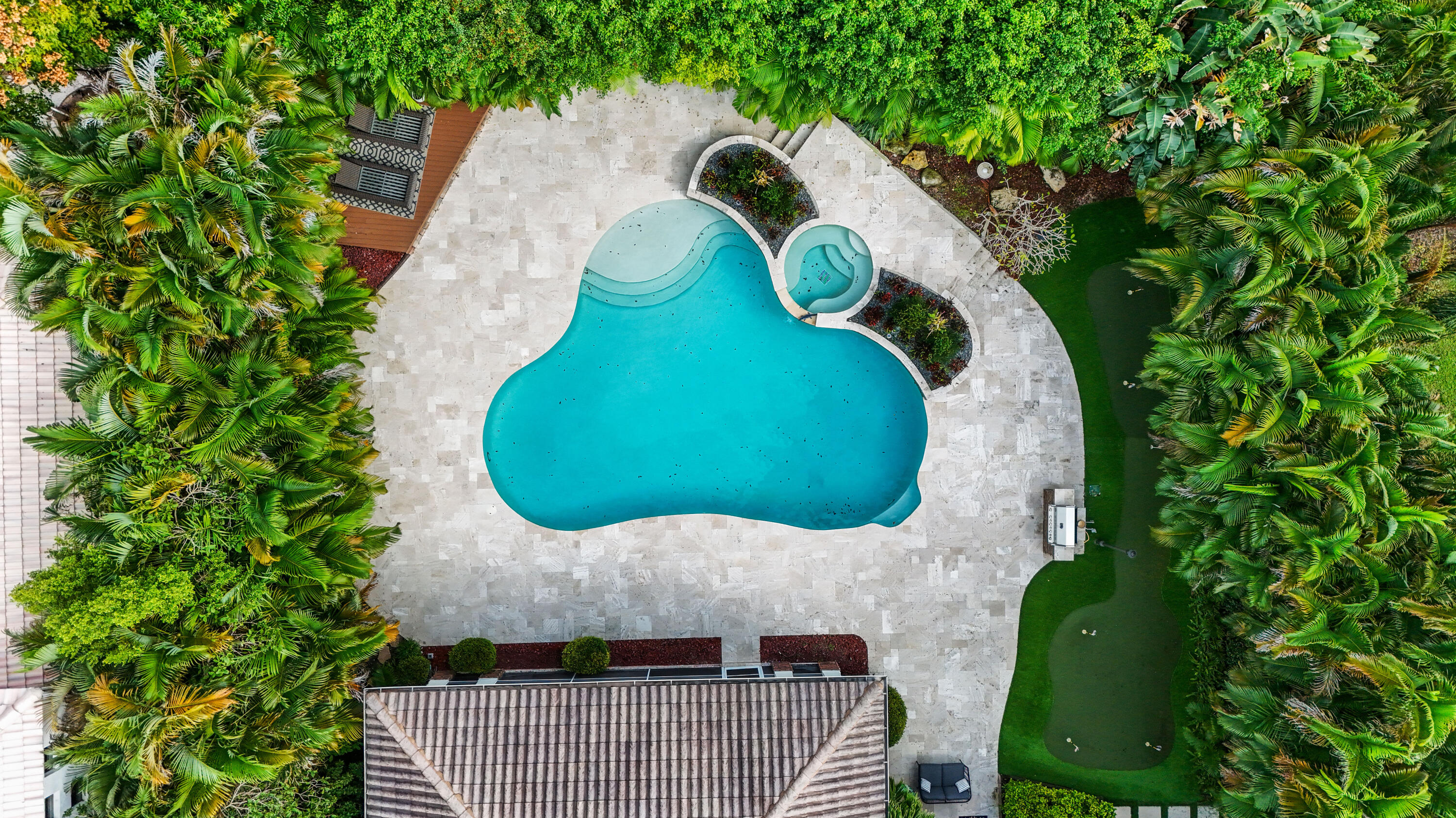 562 Rookery Place Jupiter, FL 33458 - Photo 67 of 72 an aerial view of a house with swimming pool and large trees