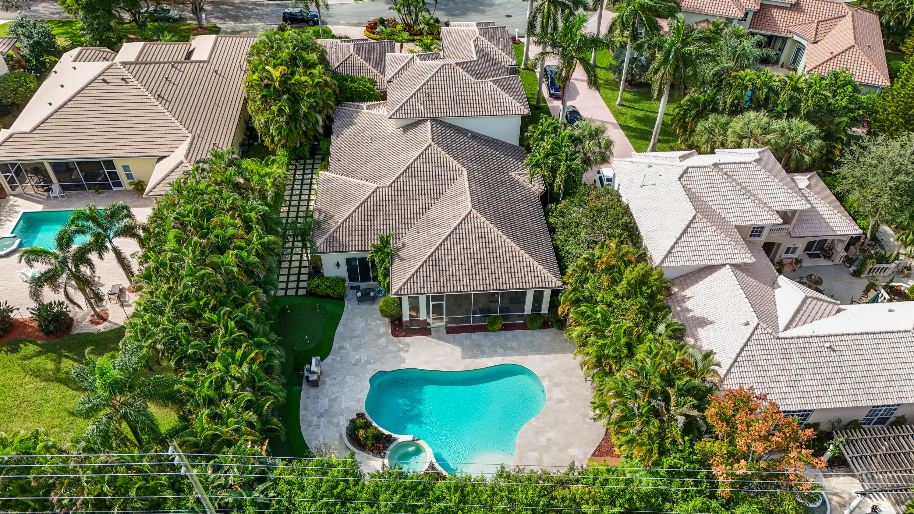 562 Rookery Place Jupiter, FL 33458 - Photo 69 of 72 an aerial view of multiple houses with yard
