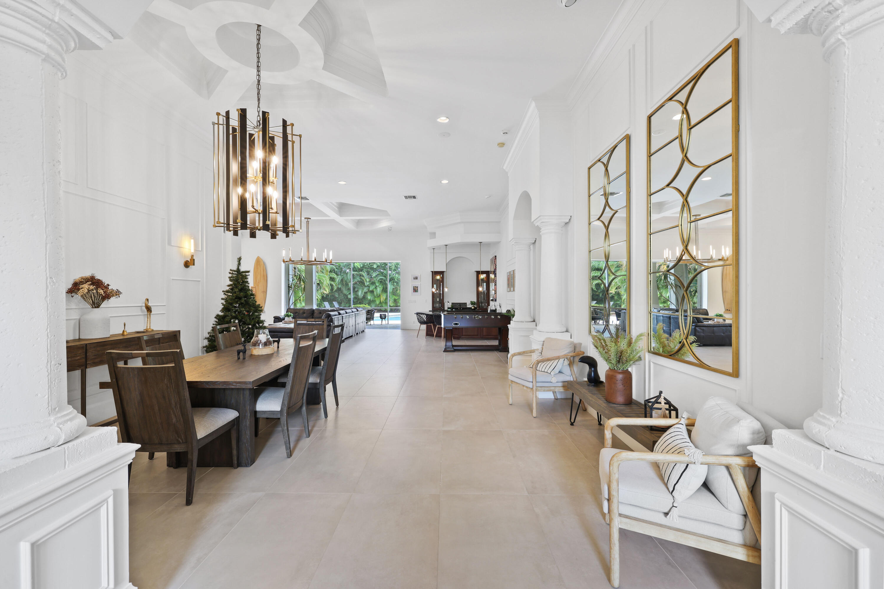 562 Rookery Place Jupiter, FL 33458 - Photo 7 of 72 a living room with furniture a window and gym equipment