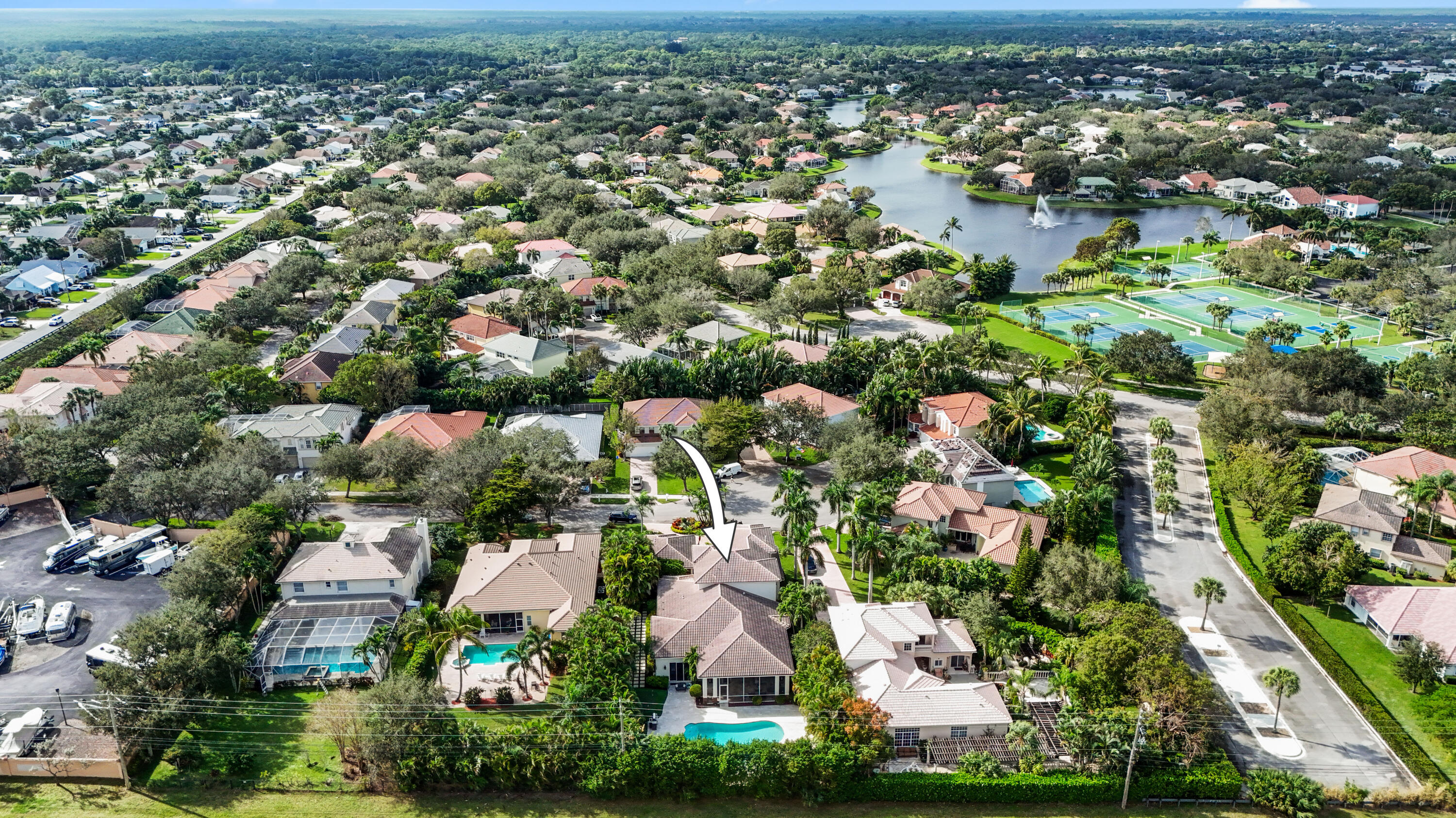 562 Rookery Place Jupiter, FL 33458 - Photo 71 of 72 an aerial view of residential houses with outdoor space and trees