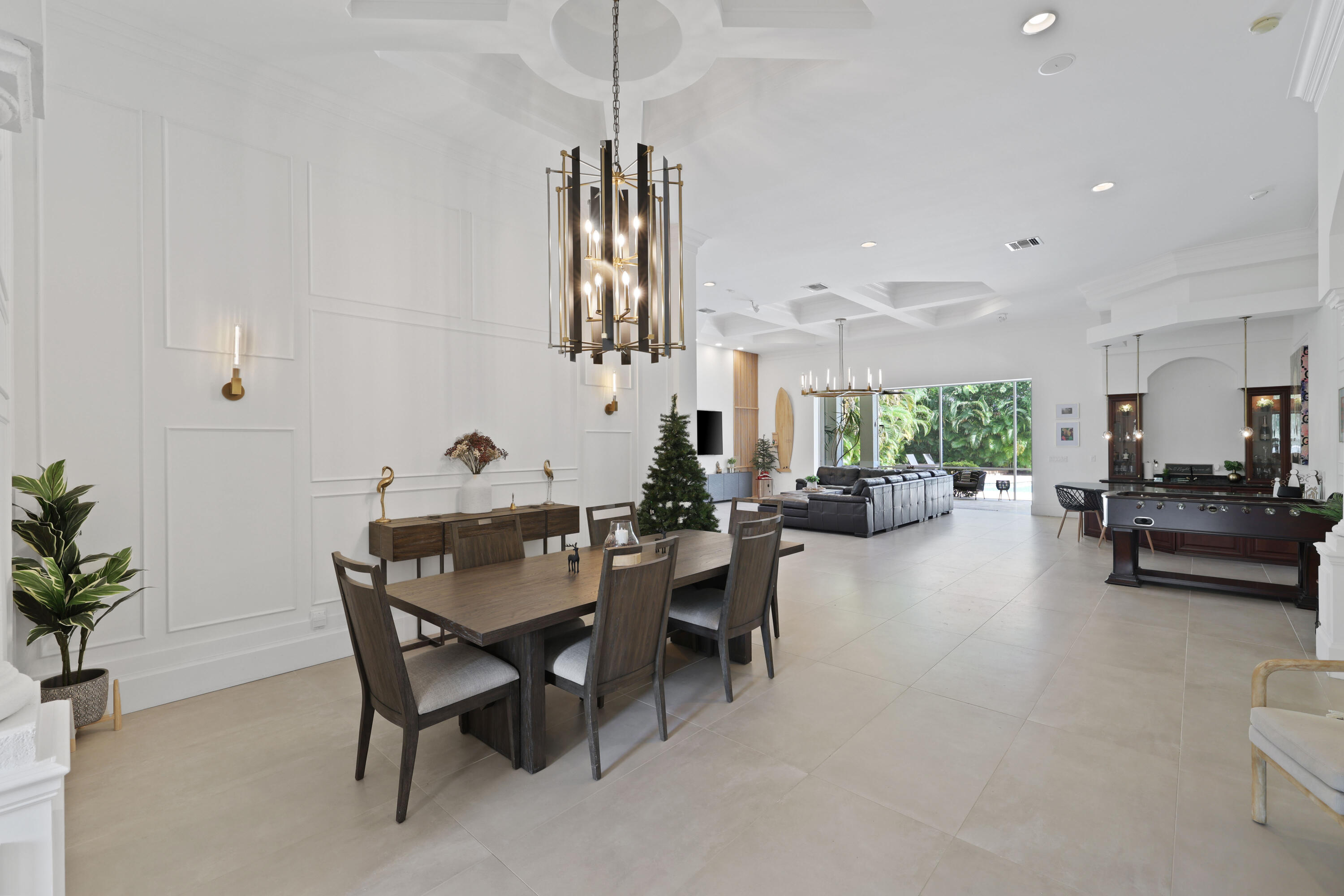 562 Rookery Place Jupiter, FL 33458 - Photo 8 of 72 a view of a dining room with furniture and a chandelier