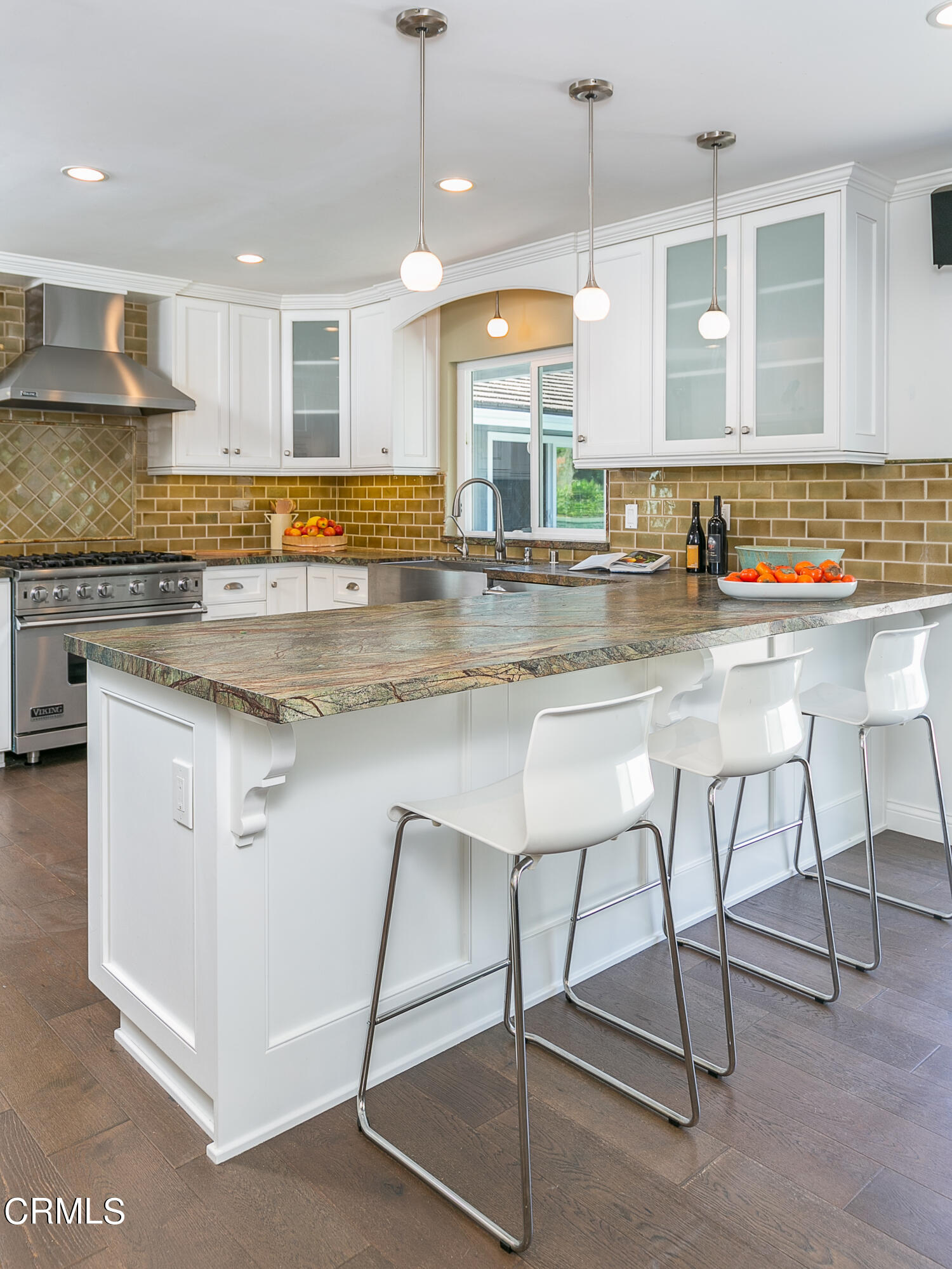 2209 Cielo Place Arcadia, CA 91006 - Photo 12 of 49 a kitchen with kitchen island granite countertop a table chairs sink and cabinets