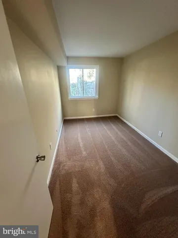 a bathroom with a shower and a mirror