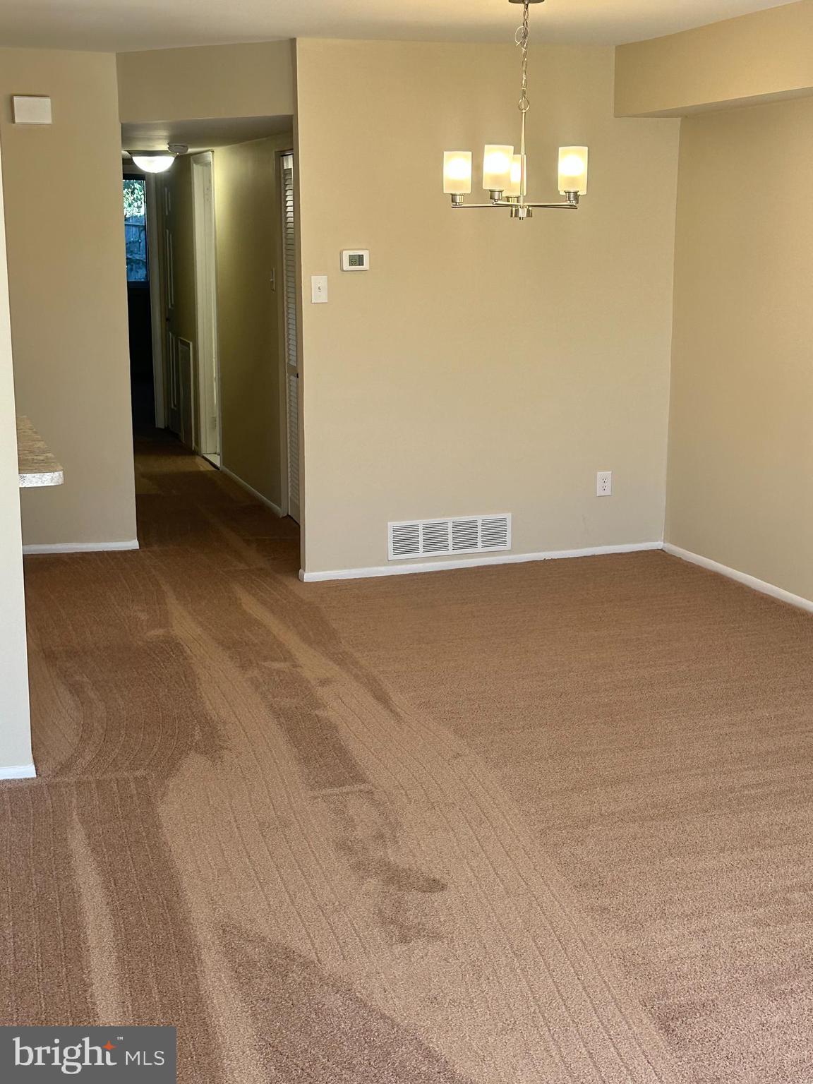 2525 Welsh Road Philadelphia, PA 19114 - Photo 4 of 22 an empty room with kitchen view and mirror