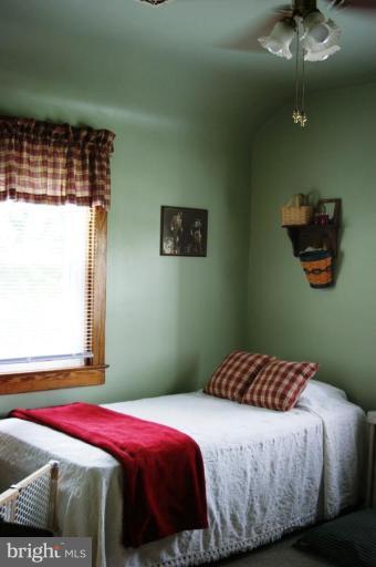 5546 Ashbourne Road Halethorpe, MD 21227 - Photo 11 of 26 a bedroom with a bed and window