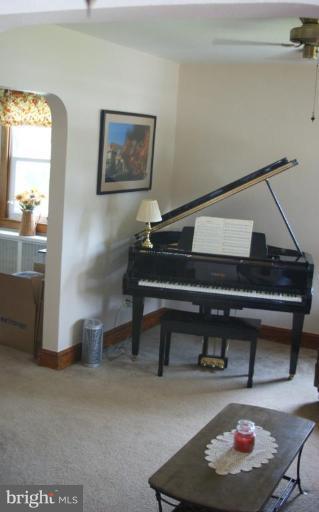 5546 Ashbourne Road Halethorpe, MD 21227 - Photo 3 of 26 a living room with furniture and a night stand