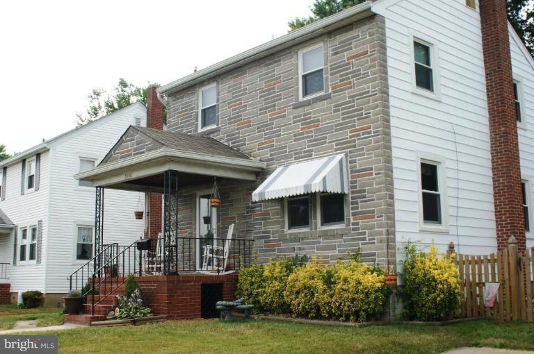 5546 Ashbourne Road Halethorpe, MD 21227 - Photo 24 of 26 a front view of a house with garden