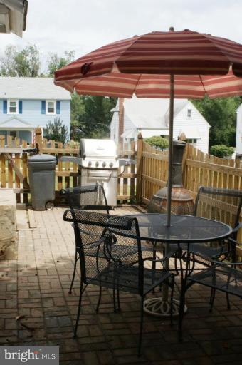 5546 Ashbourne Road Halethorpe, MD 21227 - Photo 26 of 26 a view of a terrace with furniture and stove