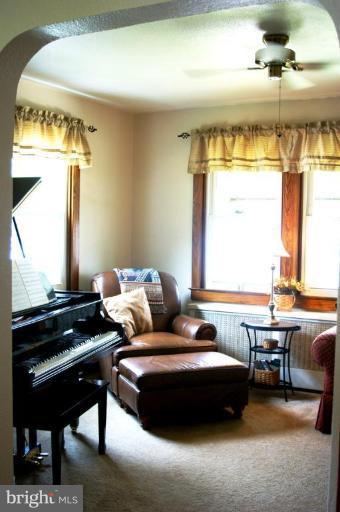 5546 Ashbourne Road Halethorpe, MD 21227 - Photo 4 of 26 a living room with furniture and a piano