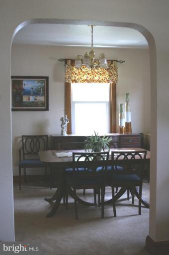 5546 Ashbourne Road Halethorpe, MD 21227 - Photo 5 of 26 a kitchen with a table and chairs in it
