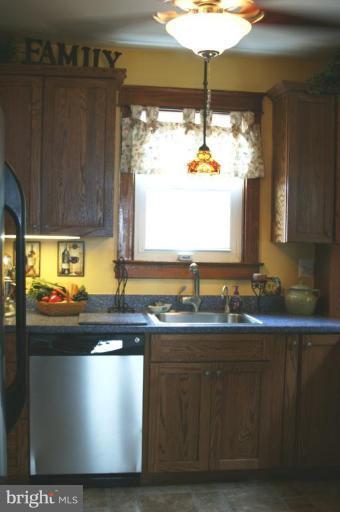 5546 Ashbourne Road Halethorpe, MD 21227 - Photo 7 of 26 a kitchen with a sink and a large window